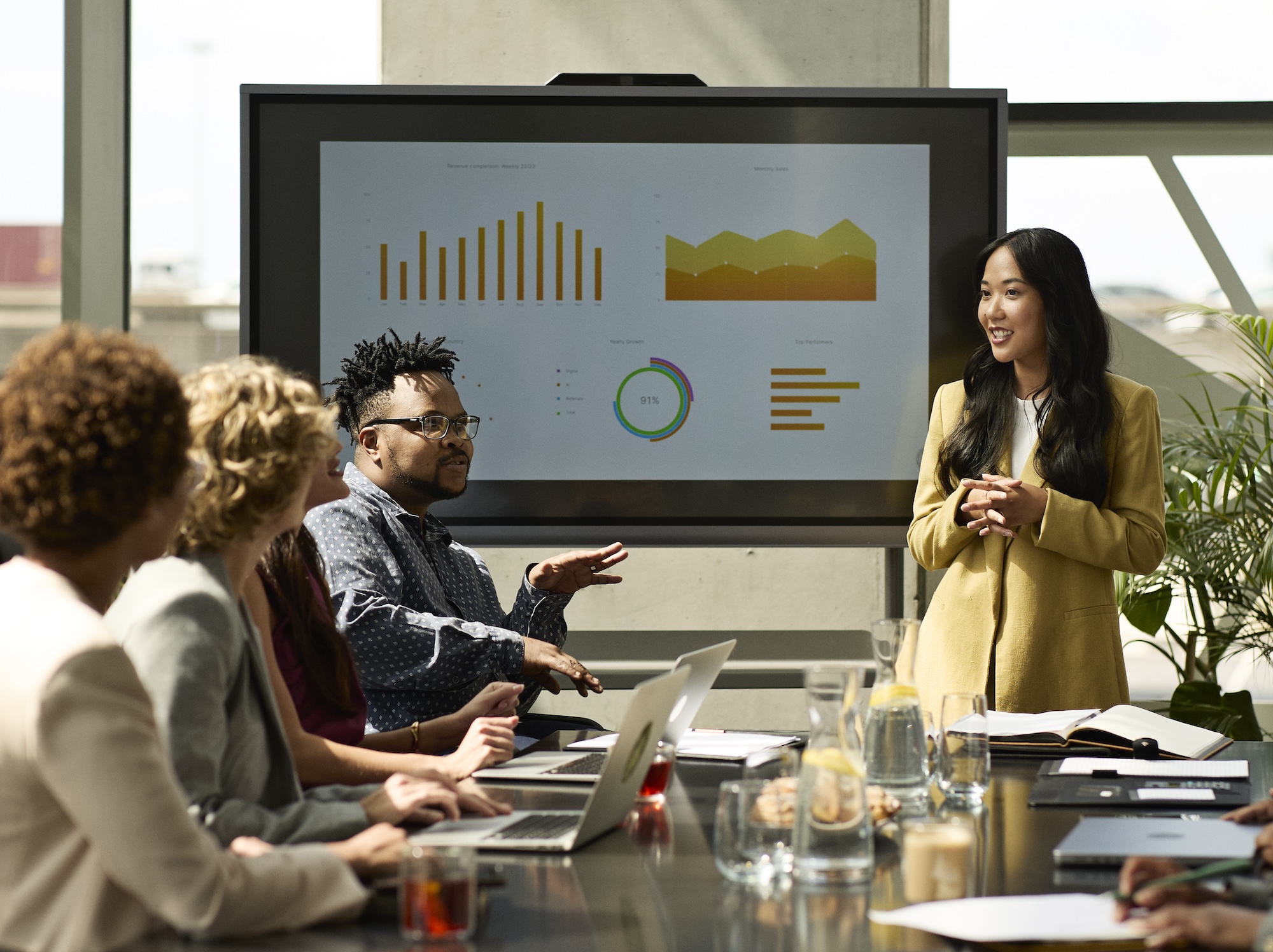 A group of office workers are discussing a report